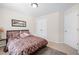 Comfortable bedroom with plush bedding, soft carpet flooring, and ample natural light, providing a relaxing and inviting atmosphere at 2283 Shady Maple Ln, Loganville, GA 30052