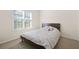 Cozy bedroom with a neutral color scheme and a large window at 2283 Shady Maple Ln, Loganville, GA 30052