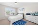 Cozy bedroom with carpet flooring, a bright window, white furniture, and matching decor offers a relaxing personal space at 2283 Shady Maple Ln, Loganville, GA 30052