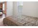 Bright bedroom with a comfortable bed and natural lighting at 2283 Shady Maple Ln, Loganville, GA 30052