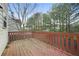 Spacious wooden deck perfect for outdoor entertaining with views of the backyard and surrounding greenery at 2283 Shady Maple Ln, Loganville, GA 30052