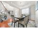 Dining room with modern table, elegant decor, and hardwood floors, perfect for entertaining at 2283 Shady Maple Ln, Loganville, GA 30052