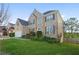Well-maintained brick home with a two-car garage, green lawn, and neatly trimmed bushes at 2283 Shady Maple Ln, Loganville, GA 30052