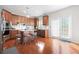 Charming kitchen with an island, stainless steel appliances, and natural light at 2283 Shady Maple Ln, Loganville, GA 30052