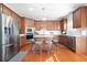 Modern kitchen featuring an island, stainless steel appliances, and abundant storage at 2283 Shady Maple Ln, Loganville, GA 30052