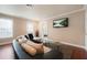 Comfortable living room with a large couch, glass coffee table, and natural light at 2283 Shady Maple Ln, Loganville, GA 30052