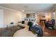 Stylish living room boasts modern furnishings, including a large sectional sofa and an open layout ideal for relaxation and entertainment at 2283 Shady Maple Ln, Loganville, GA 30052