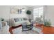 Cozy living room with elegant furniture, hardwood floors, and plenty of natural light at 2283 Shady Maple Ln, Loganville, GA 30052