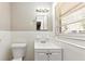 Bright bathroom featuring a white tiled backsplash, single sink, and a window at 4281 Welbron Dr, Decatur, GA 30035