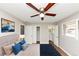 Bright bedroom featuring a ceiling fan, neutral walls, and a view to the bathroom at 4281 Welbron Dr, Decatur, GA 30035