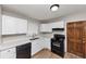 Well-lit kitchen featuring white cabinetry, laminate countertops, and modern appliances at 4281 Welbron Dr, Decatur, GA 30035