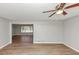 Living room with laminate wood flooring, neutral walls, and a view into another room at 4281 Welbron Dr, Decatur, GA 30035