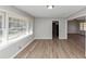 Bright living room featuring laminate wood flooring, neutral walls, and a large window at 4281 Welbron Dr, Decatur, GA 30035