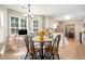 Cozy breakfast nook featuring a round table, chairs, and a bright window-lit desk space at 524 Plantation Creek Dr, Loganville, GA 30052