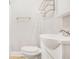 Simple bathroom with white fixtures, including a pedestal sink and toilet at 706 S Grand Nw Ave, Atlanta, GA 30318
