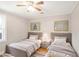 Cozy bedroom with two twin beds and soft, neutral decor at 706 S Grand Nw Ave, Atlanta, GA 30318
