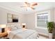Calm bedroom with soft lighting, a neutral palette, and a large window at 706 S Grand Nw Ave, Atlanta, GA 30318