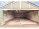 Detached garage with block walls, cement floor, and damaged roof at 706 S Grand Nw Ave, Atlanta, GA 30318