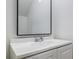 Simple bathroom with white sink and vanity, and black-framed mirror at 813 Smith Sw St # B, Atlanta, GA 30310