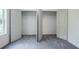 Bedroom with two walk-in closets, featuring a spacious layout, plush carpet, and ample storage at 813 Smith Sw St # B, Atlanta, GA 30310