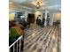Open-concept living room with modern lighting and wood-look floors at 2184 E Cherokee Dr, Woodstock, GA 30188
