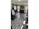 Versatile living space filled with natural light, suitable for dining, fitness, and recreation activities at 2184 E Cherokee Dr, Woodstock, GA 30188