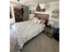 Comfortable main bedroom featuring a large bed, soft lighting, and stylish decor at 2184 E Cherokee Dr, Woodstock, GA 30188