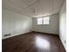 The basement features wood-look flooring and natural light from a window at 2717 Rosemont Dr, Lawrenceville, GA 30044