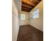 The unfinished basement provides extra space for storage with windows and installed shelving at 2717 Rosemont Dr, Lawrenceville, GA 30044