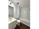 Bathroom featuring new fixtures, bathtub and wood-look flooring at 2717 Rosemont Dr, Lawrenceville, GA 30044