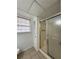 This bathroom features a tiled floor and a shower stall, plus a linen closet for storage at 2717 Rosemont Dr, Lawrenceville, GA 30044