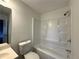 This bathroom features a shower and tub with a vanity and toilet at 2717 Rosemont Dr, Lawrenceville, GA 30044