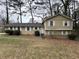 Charming split-level home with light yellow siding, white trim, and a well-maintained front yard at 2717 Rosemont Dr, Lawrenceville, GA 30044