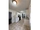 Well-lit kitchen features white cabinets, granite countertops, tile flooring, and modern appliances at 2717 Rosemont Dr, Lawrenceville, GA 30044