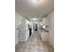 Bright kitchen featuring white cabinets, granite countertops, tile flooring, and modern appliances at 2717 Rosemont Dr, Lawrenceville, GA 30044