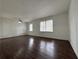 Bright living room featuring hardwood floors and large windows that allow plenty of natural light at 2717 Rosemont Dr, Lawrenceville, GA 30044