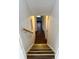 This stairwell features stairs with yellow traction stripes and a hardwood landing at 2717 Rosemont Dr, Lawrenceville, GA 30044