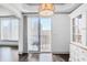 Living room with balcony access and city views, as well as white cabinetry at 3445 Stratford Ne Rd # 502, Atlanta, GA 30326