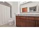 Bathroom featuring a granite double vanity, framed mirror, and a shower-tub combination at 3445 Stratford Ne Rd # 502, Atlanta, GA 30326
