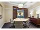 Conference room featuring a modern round table, comfortable seating, and large windows at 3445 Stratford Ne Rd # 502, Atlanta, GA 30326