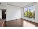 Bright living room boasts hardwood floors and large windows with city views at 3445 Stratford Ne Rd # 502, Atlanta, GA 30326
