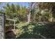 Backyard featuring a large tree, grass, and bamboo at 3542 W Hill St, Clarkston, GA 30021