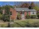 Charming brick home featuring a well-manicured lawn and cozy front entrance at 3542 W Hill St, Clarkston, GA 30021