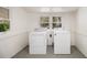 Light filled laundry room offering a new washer and dryer plus natural light at 3542 W Hill St, Clarkston, GA 30021