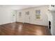 Spacious living room with hardwood floors, bright windows, and a cozy fireplace at 3542 W Hill St, Clarkston, GA 30021