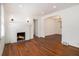 Charming living room featuring hardwood floors, a cozy fireplace, and an open layout at 3542 W Hill St, Clarkston, GA 30021