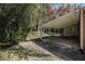 A covered patio and backyard with trees at 3542 W Hill St, Clarkston, GA 30021