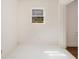 Small bonus room with painted floors and a bright window at 3542 W Hill St, Clarkston, GA 30021