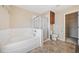 Bathroom featuring a soaking tub, a glass-enclosed shower, and a separate water closet at 1296 Park Pass Way, Suwanee, GA 30024