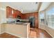 Modern kitchen featuring granite countertops, stainless steel appliances, and ample cabinet space at 1296 Park Pass Way, Suwanee, GA 30024